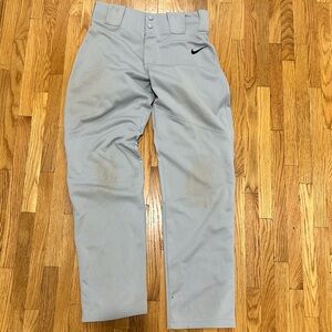 Baseball pants last picture or first has two pairs with rips on side.